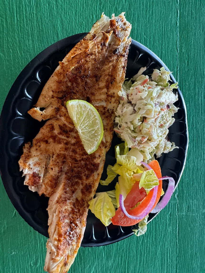 A fish plate with slaw